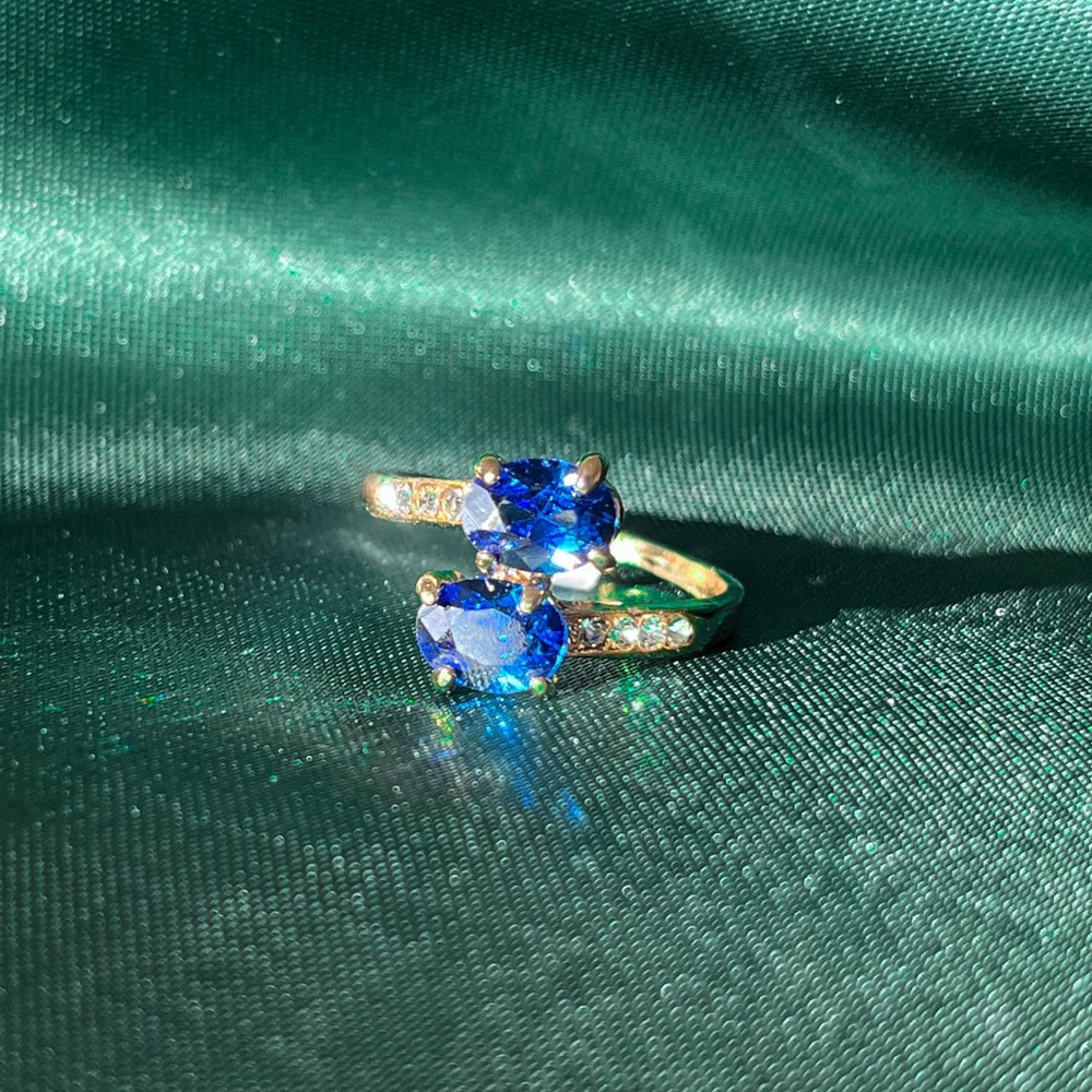 Gold Alloy Ring With Clear And Blue Gems